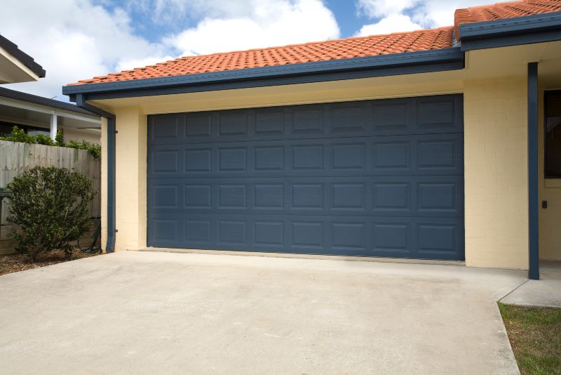 residential concrete pro concrete driveway leading up to a family home garage